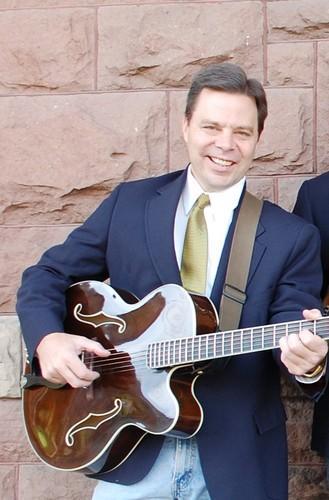 Donald Kaufman playing guitar